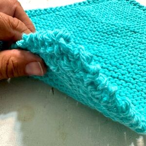 Fresh hand knitted cotton wash cloth by the wife. Turquoise in color.bin#6